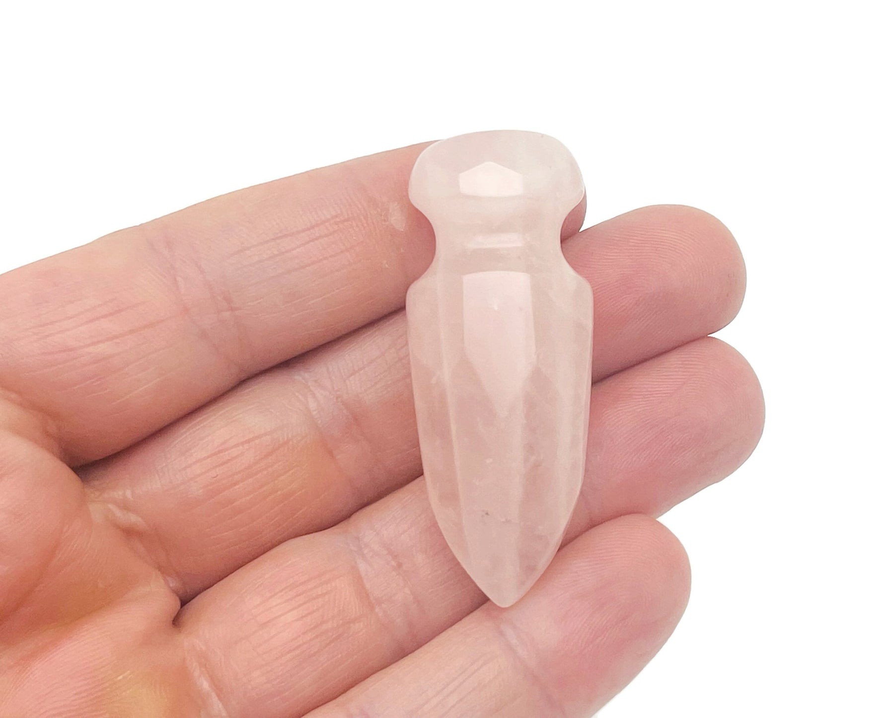 Carved rose quartz sword dagger gemstone, 50mm, with detailed craftsmanship and natural pink color, by GemstoneGO.