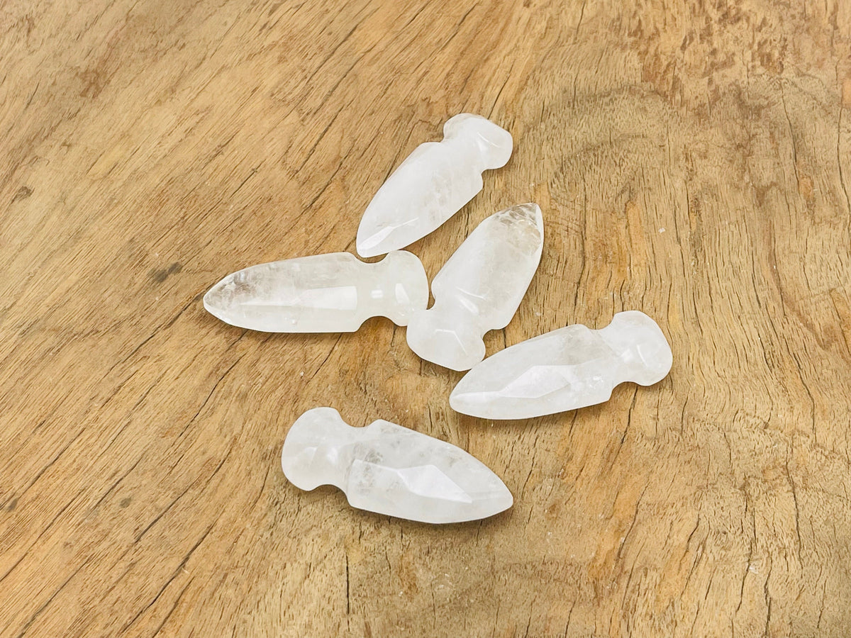 Clear quartz sword dagger carved gemstone, 50mm, from GemstoneGO, showcasing intricate carvings and a polished, transparent appearance.