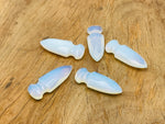 Opalite gemstone dagger with carved sword design, 50mm length, showcasing a smooth, iridescent carved gemstone blade.