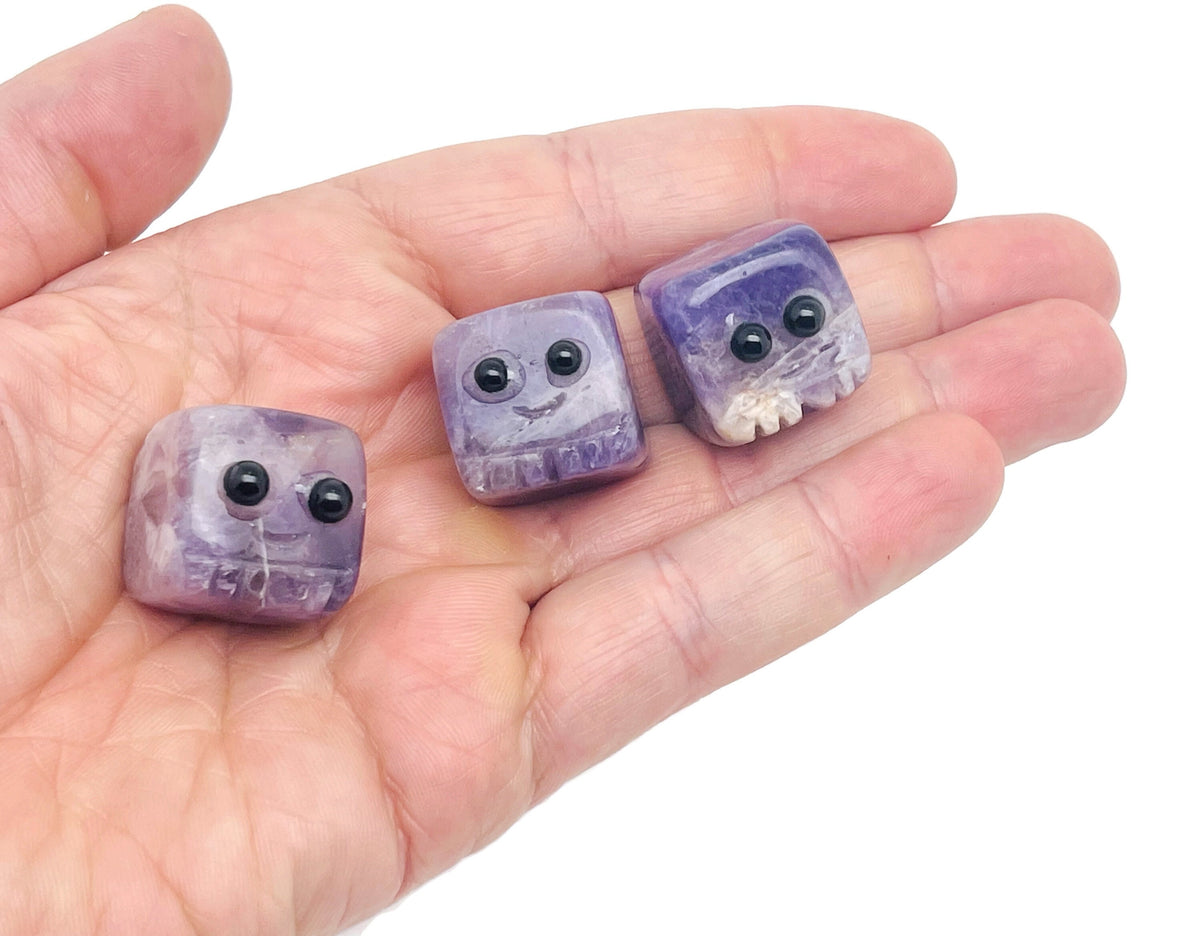 Hand-carved gemstone skull figurine from GemstoneGO, featuring colorful healing chakra crystals, ideal as a crystal gift or decorative piece