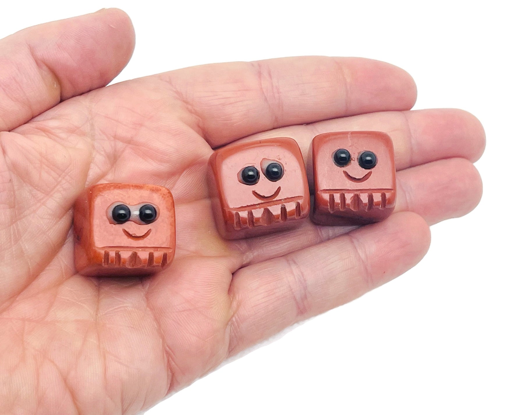 Hand-carved gemstone skull figurine by GemstoneGO, featuring vibrant colors, detailed carving, and healing chakra properties.