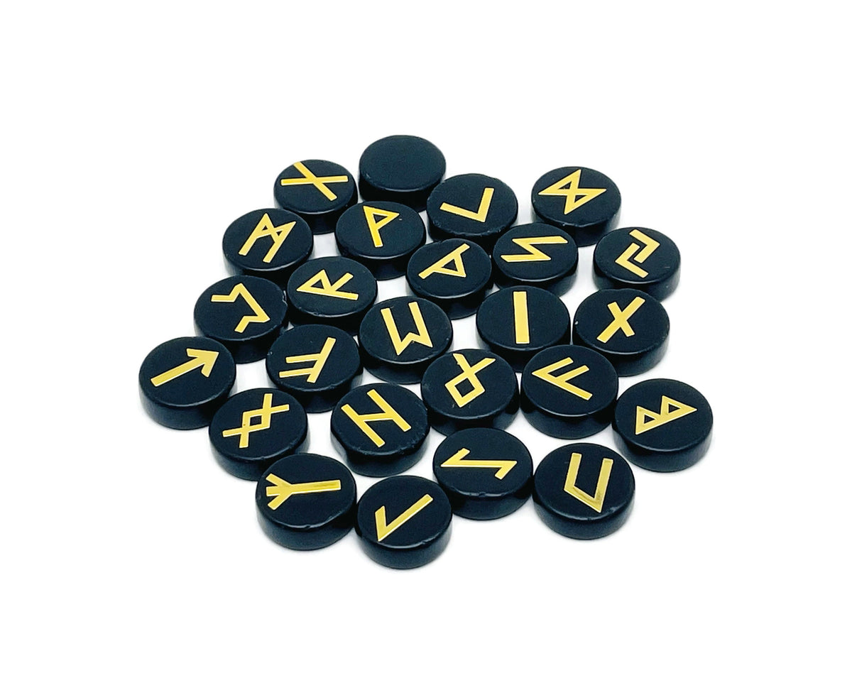 Set of 25 obsidian crystal rune stones engraved with Elder Futhark alphabet, part of GemstoneGO's crystal rune set.