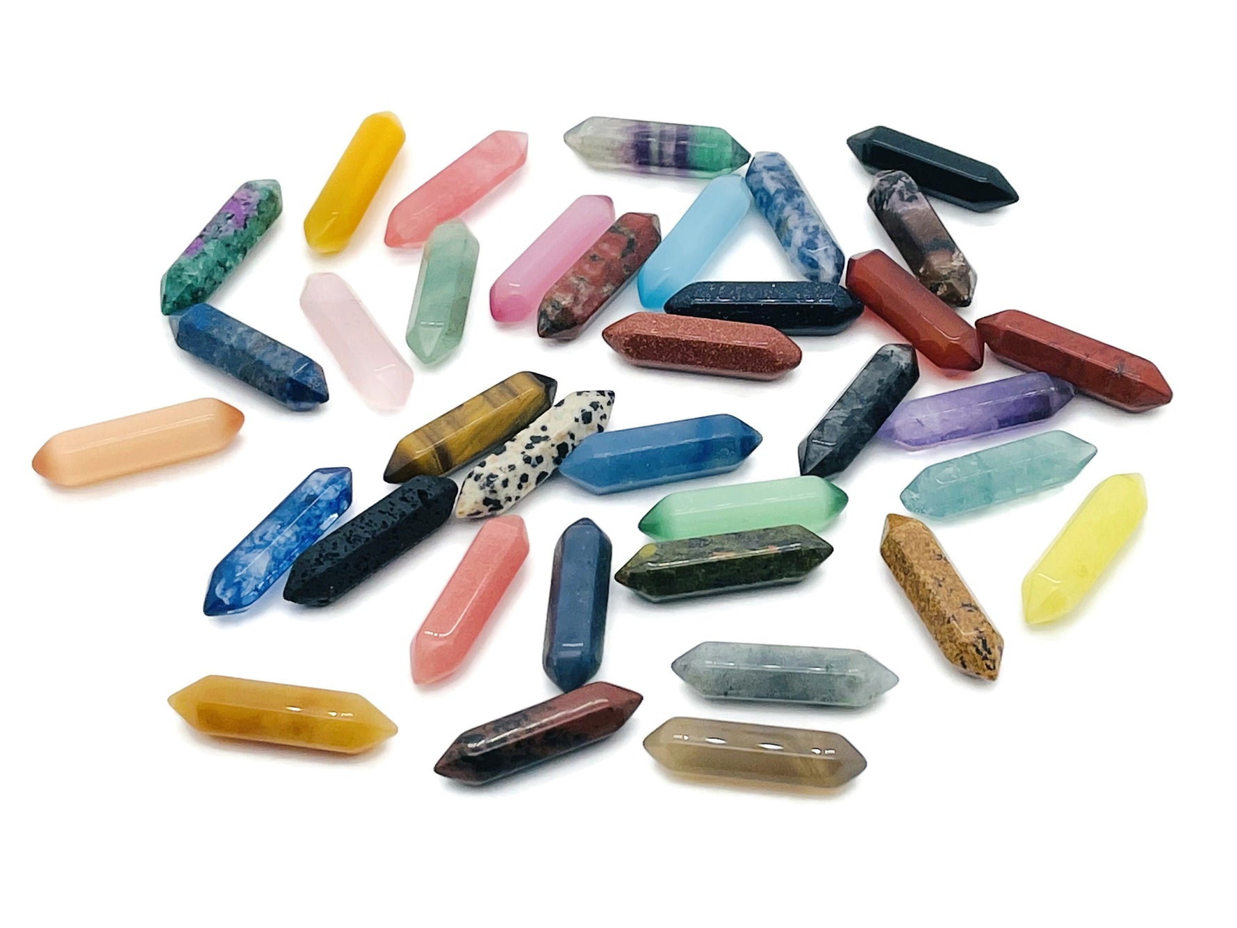 Set of 10 randomly selected gemstone energy crystals from GemstoneGO's Crystal Mystery Box Gift with carved points.