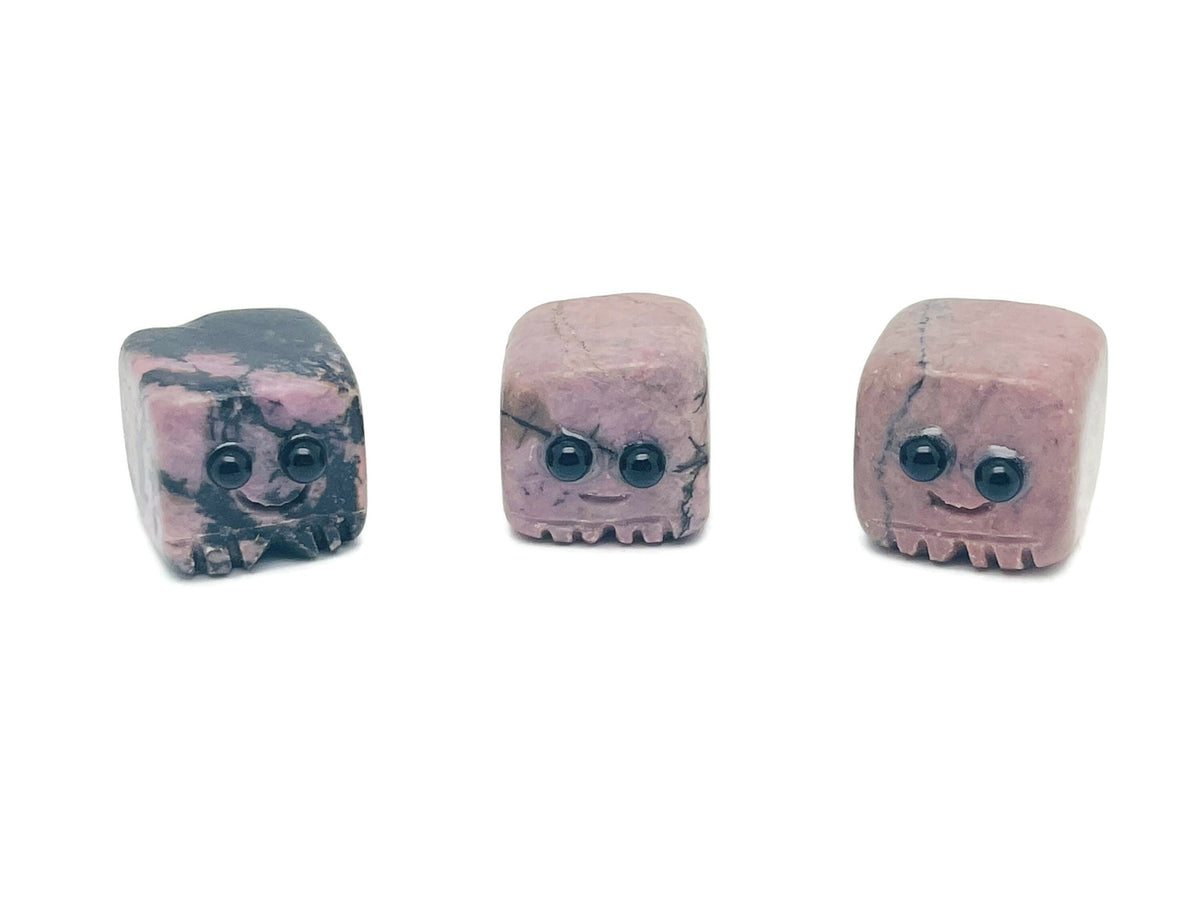 Handmade Rhodonite gemstone carving skull with detailed features, suitable as a crystal gift for kids, by GemstoneGO.