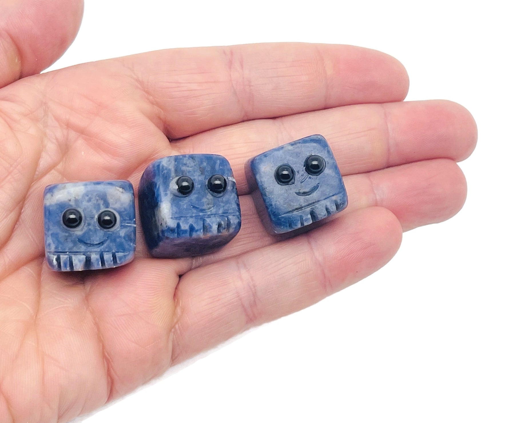 Handmade sodalite gemstone skull carving with blue and white patterns, perfect as a crystal gift for kids from GemstoneGO.