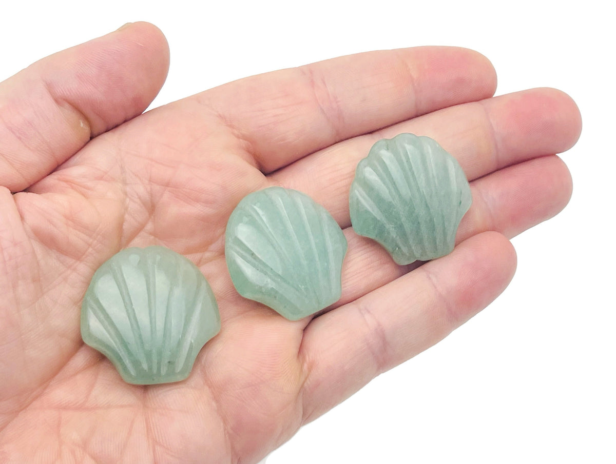 A 30mm Aventurine sea shell carving gemstone from GemstoneGO, showcasing polished green stone with shell-like design.