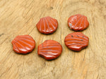 Red Jasper sea shell carving gemstone, 30mm, from GemstoneGO, featuring detailed shell design and vibrant red color.