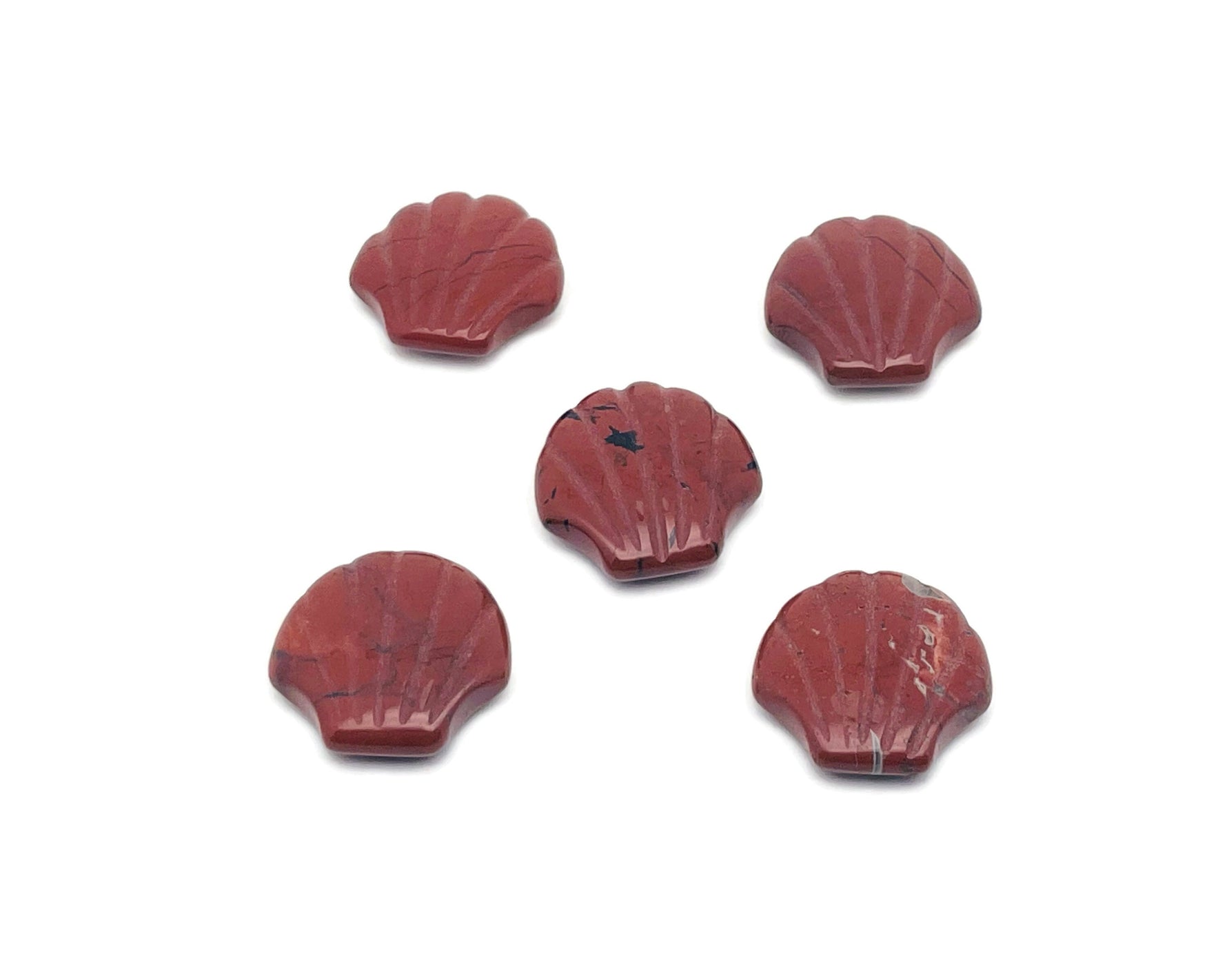 Red Jasper sea shell carving gemstone, 30mm, from GemstoneGO, featuring intricate shell details and rich red color.