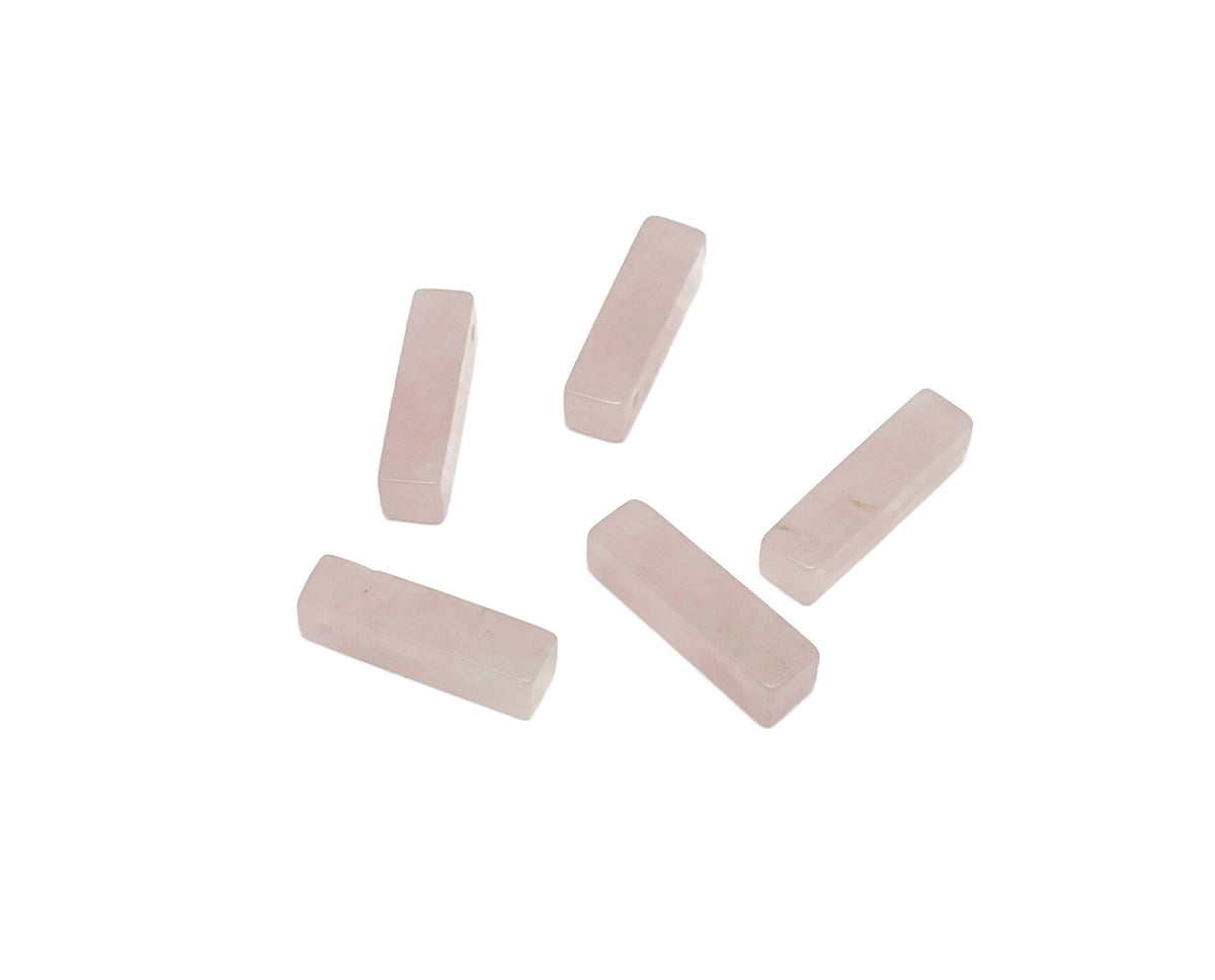 Rose Quartz crystal pendant from GemstoneGO, drilled for jewelry making, showcasing its soft pink color and smooth polished surface.