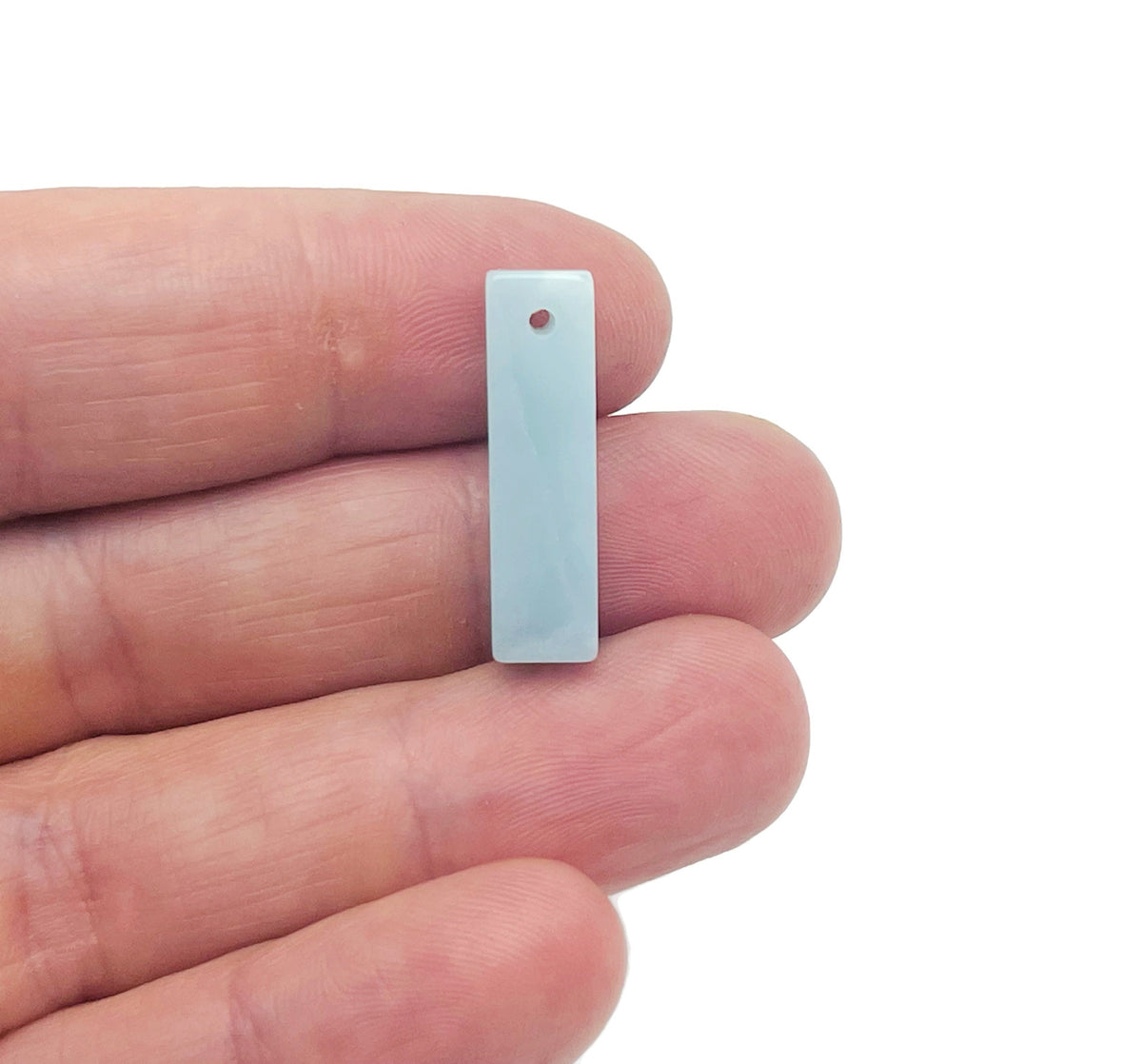 Amazonite crystal pendant from GemstoneGO, drilled gemstone for jewelry making, showcasing a smooth, polished blue-green stone.