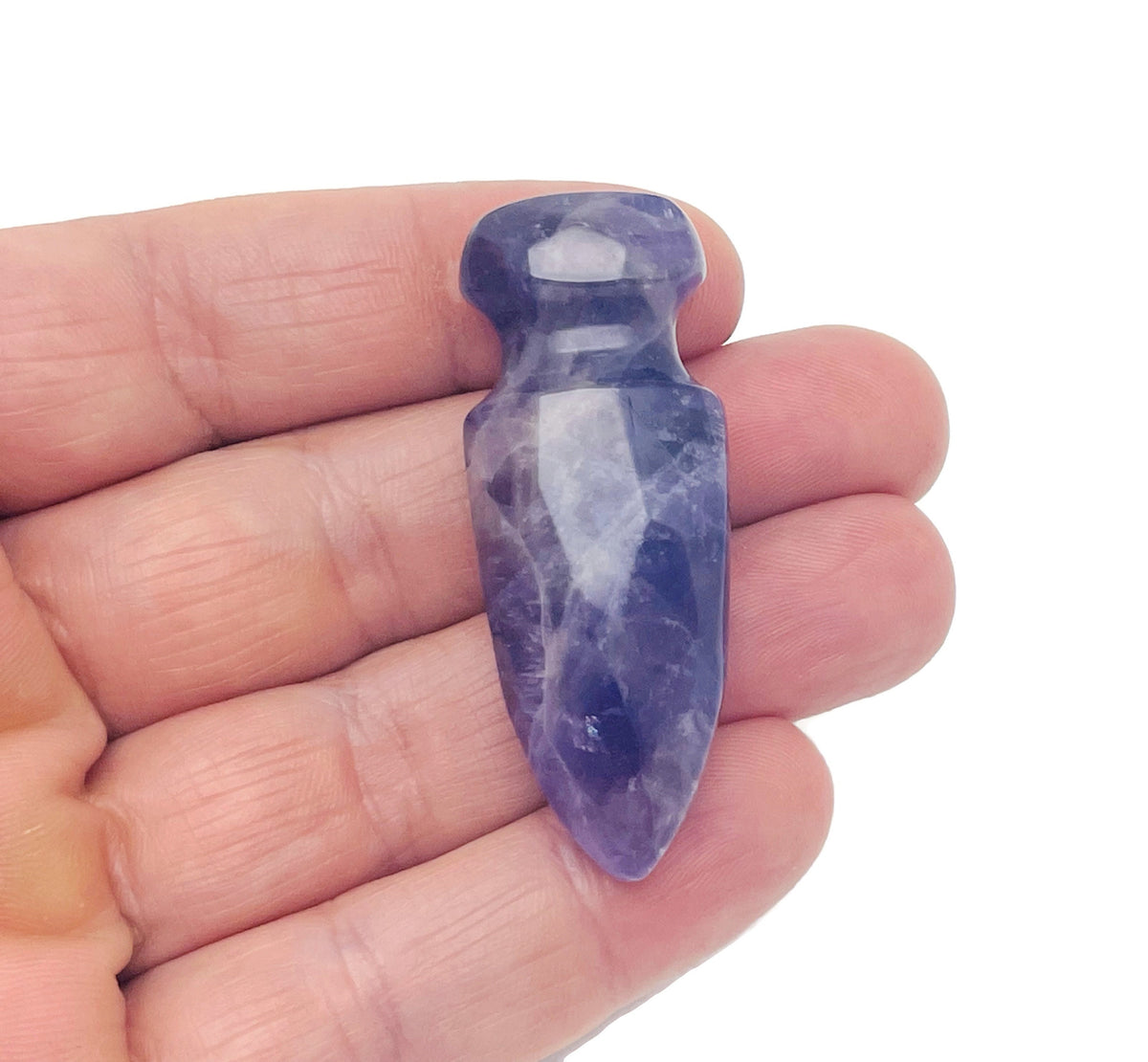 Carved amethyst sword dagger gemstone measuring 50mm with intricate details, showcased by GemstoneGO.