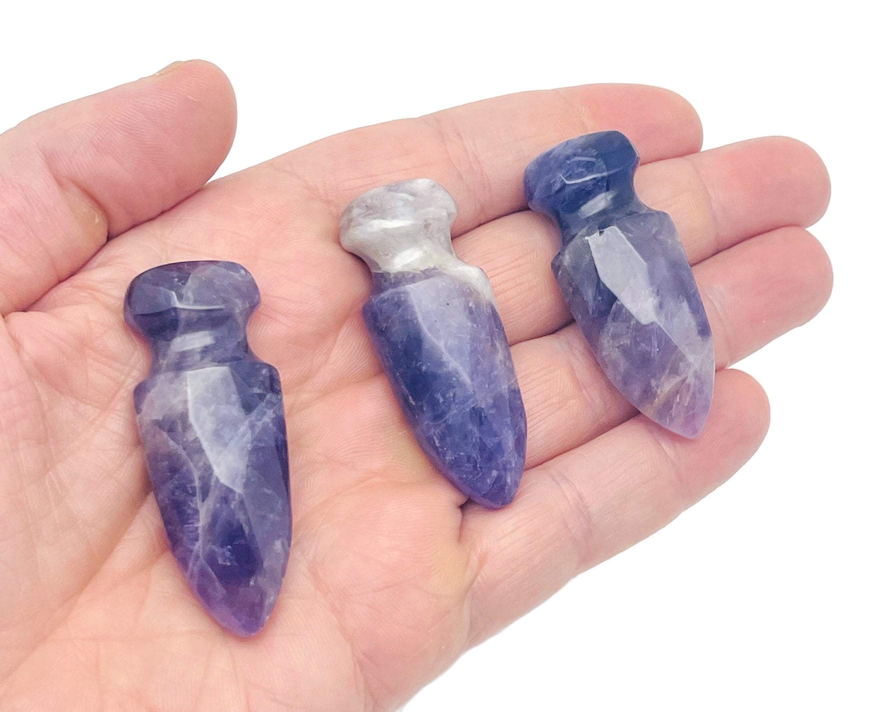 Carved amethyst gemstone sword dagger pendant, 50mm, with intricate details, displayed on a neutral background.