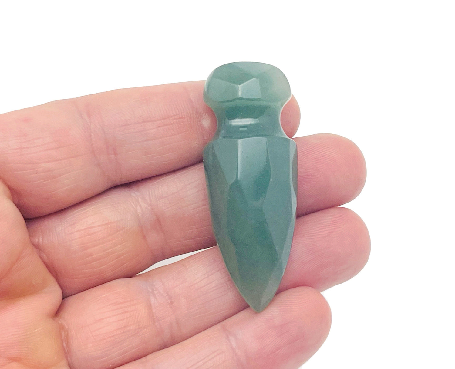 A 50mm carved aventurine gemstone dagger with intricate details, showcasing the gemstone's green color and craftsmanship.