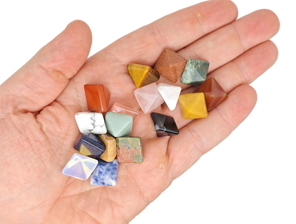 Assorted gemstones in a pyramid shape from GemstoneGO's Crystal Mystery Box Gift Kit, featuring 10 randomly selected crystals.