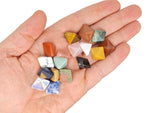 Assorted gemstones in a pyramid shape from GemstoneGO's Crystal Mystery Box Gift Kit, featuring 10 randomly selected crystals.