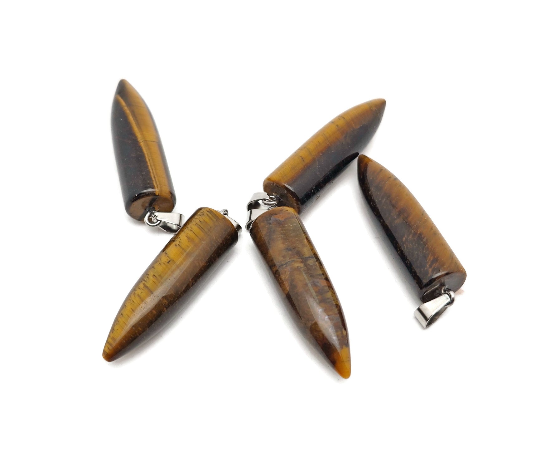 Polished tiger eye bullet gemstone pendant with carved details, showcasing warm brown and golden hues, by GemstoneGO.