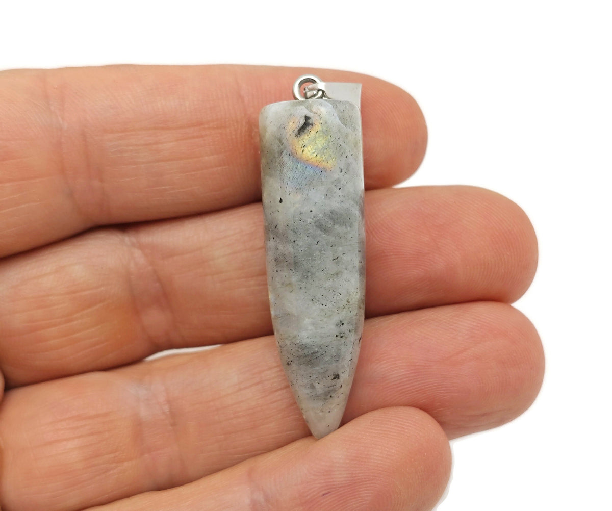 Polished Labradorite bullet gemstone pendant with carved details, featuring iridescent blue and green flashes, by GemstoneGO.