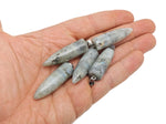 Polished Labradorite bullet gemstone pendant with carved details, showcasing iridescent blue and green flash, by GemstoneGO.