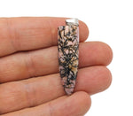 Polished Rhodonite bullet gemstone pendant with carved details, featuring a smooth, polished finish on a natural gemstone necklace.