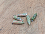 Polished Unakite bullet gemstone pendant with carved details, featuring earthy green and pink tones, from GemstoneGO.
