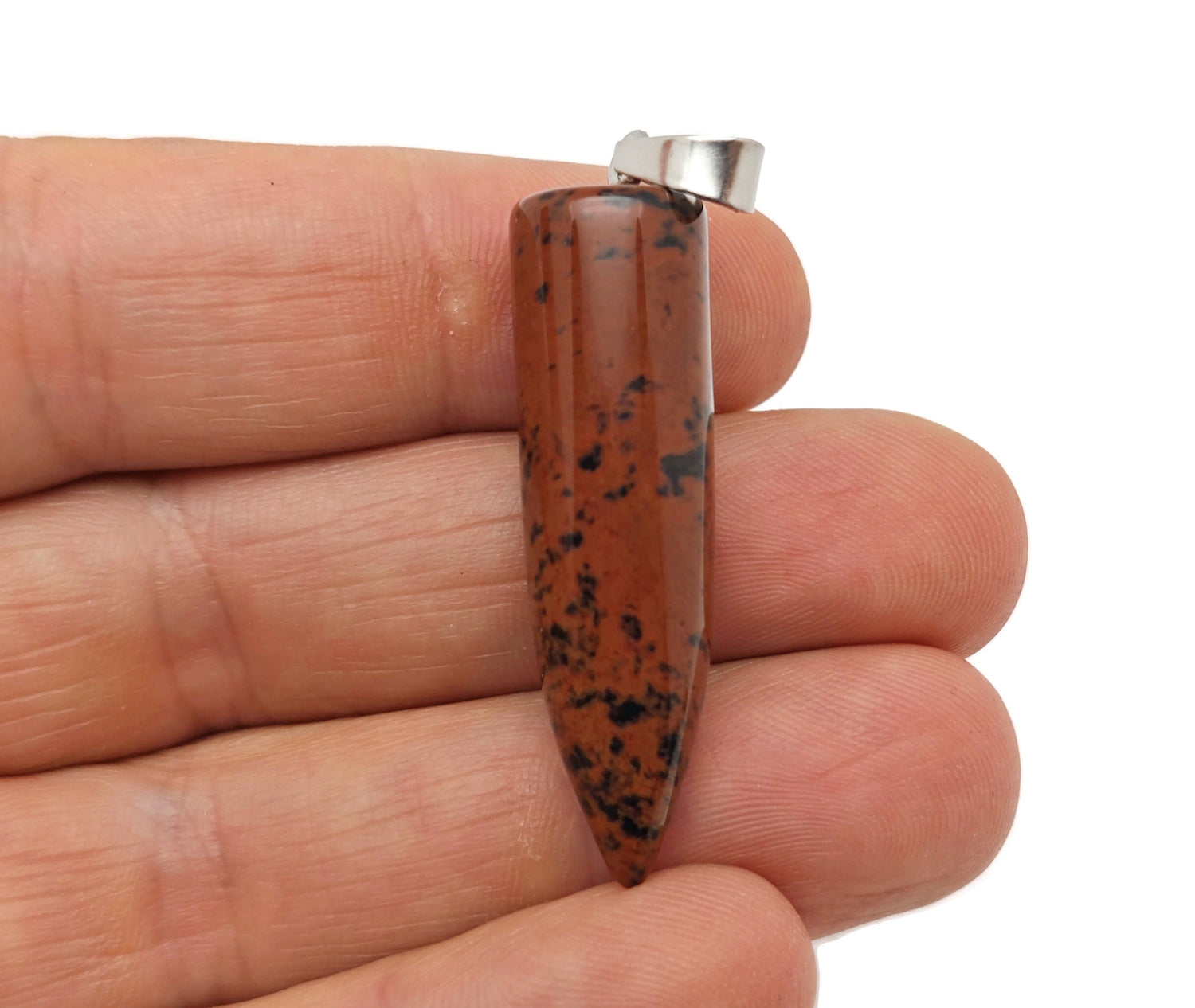 Polished mahogany obsidian bullet-shaped gemstone pendant with carved details, hanging from a silver chain.