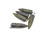 Polished Dragon Blood Jasper bullet gemstone pendant with carved details, featuring a vibrant red and brown natural stone design.
