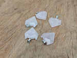 Rose quartz wolf head gemstone pendant from GemstoneGO, featuring detailed crystal jewelry with a polished rose quartz finish.