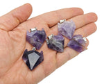 Amethyst gemstone wolf head pendant featuring detailed crystal jewelry design with purple amethyst stones.