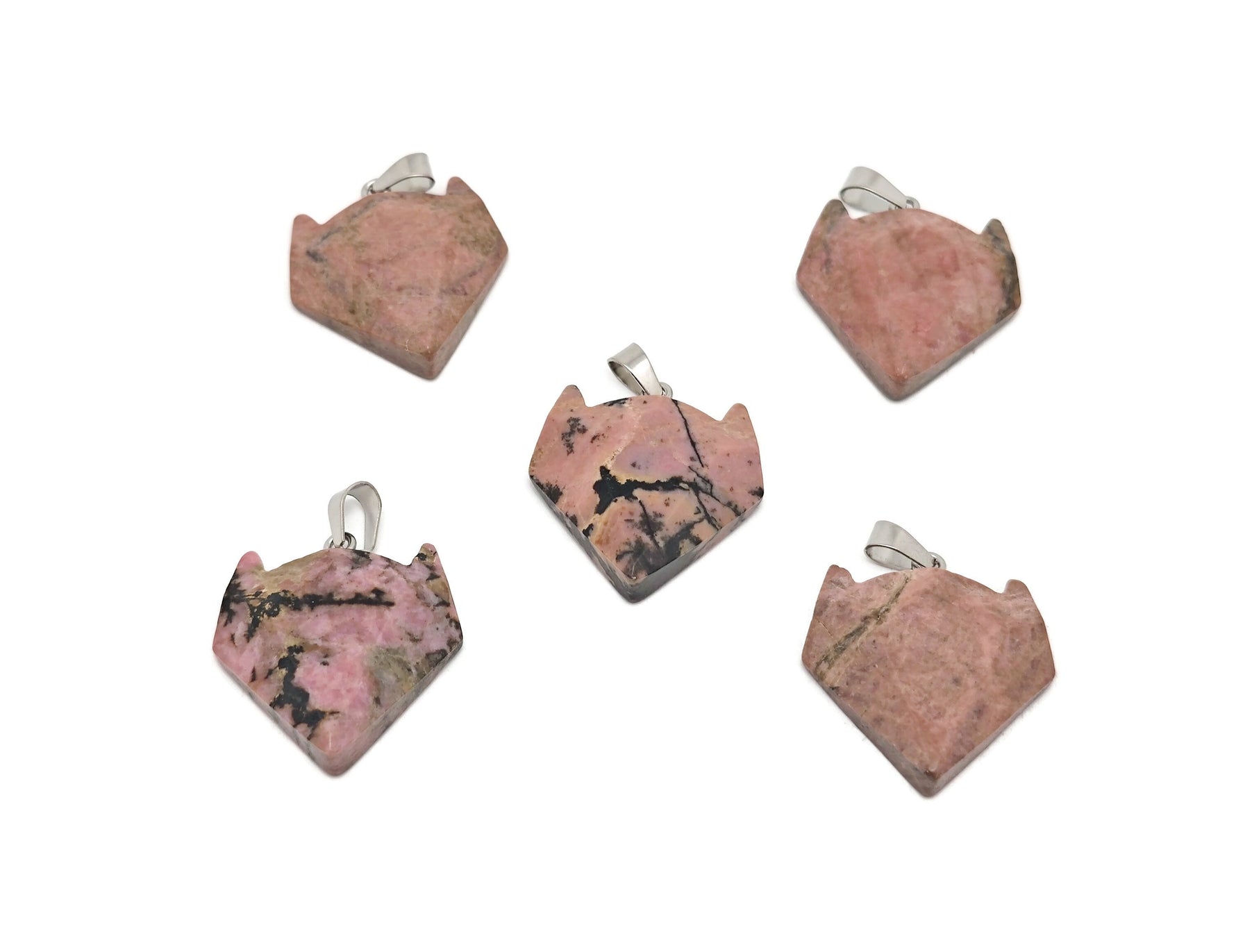 Rhodonite wolf head gemstone pendant from GemstoneGO featuring a polished crystal jewelry piece with intricate wolf design.