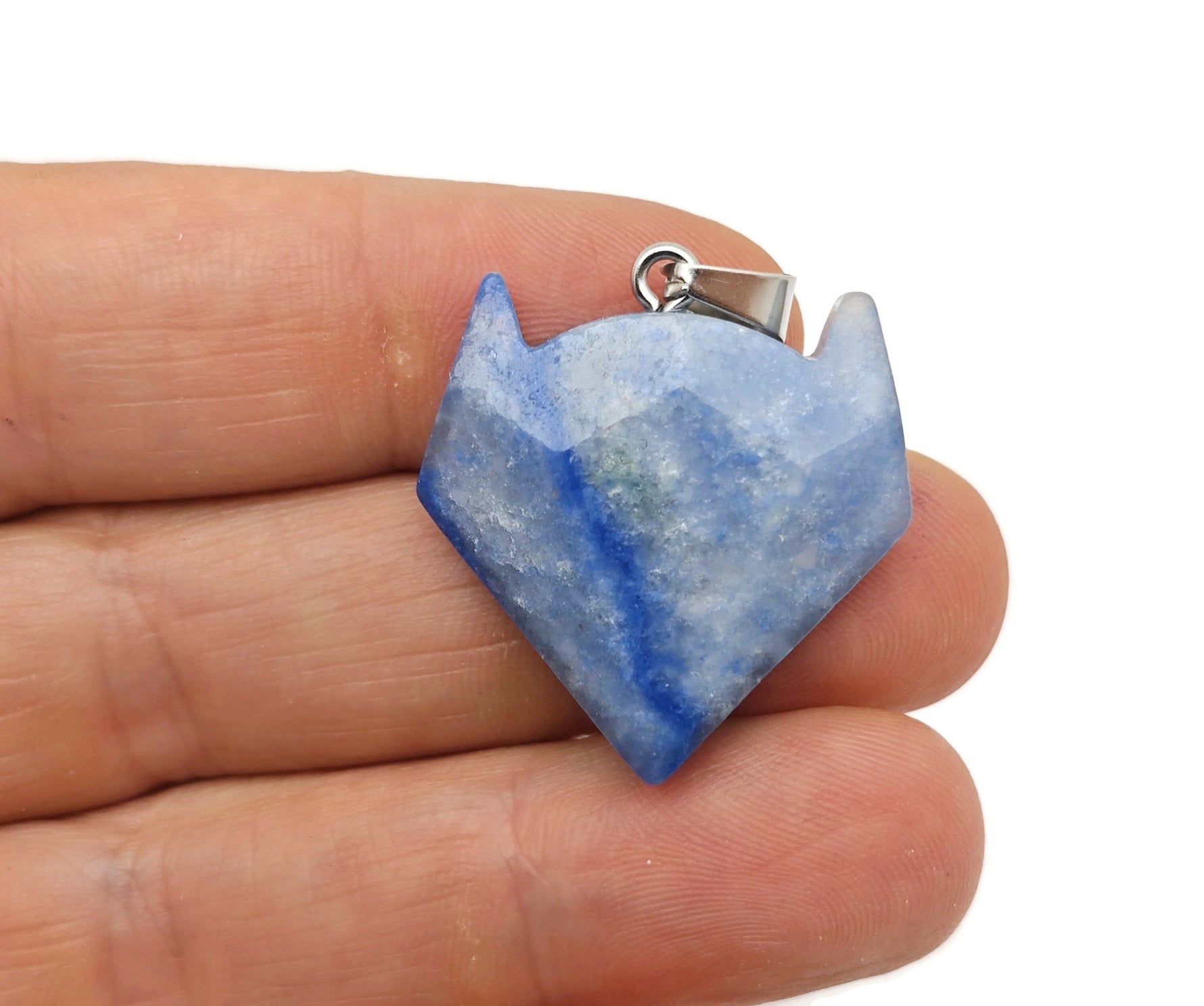Blue aventurine wolf head gemstone pendant from GemstoneGO, featuring detailed crystal jewelry with a vibrant blue gemstone design.