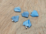 Blue aventurine wolf head gemstone pendant featuring detailed craftsmanship and vibrant blue color in crystal jewelry.