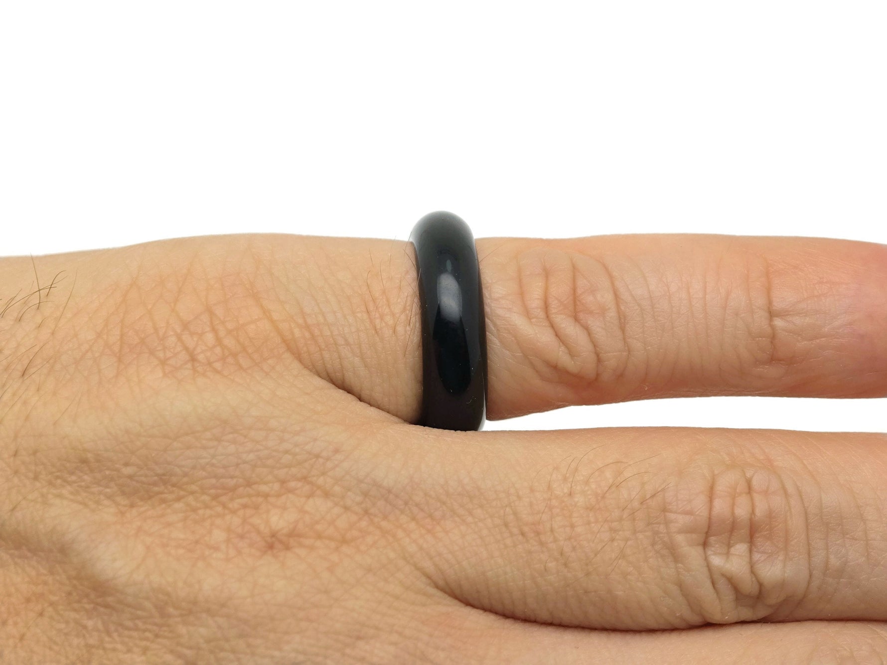 Obsidian crystal ring by GemstoneGO featuring a polished black volcanic stone set in a silver band.