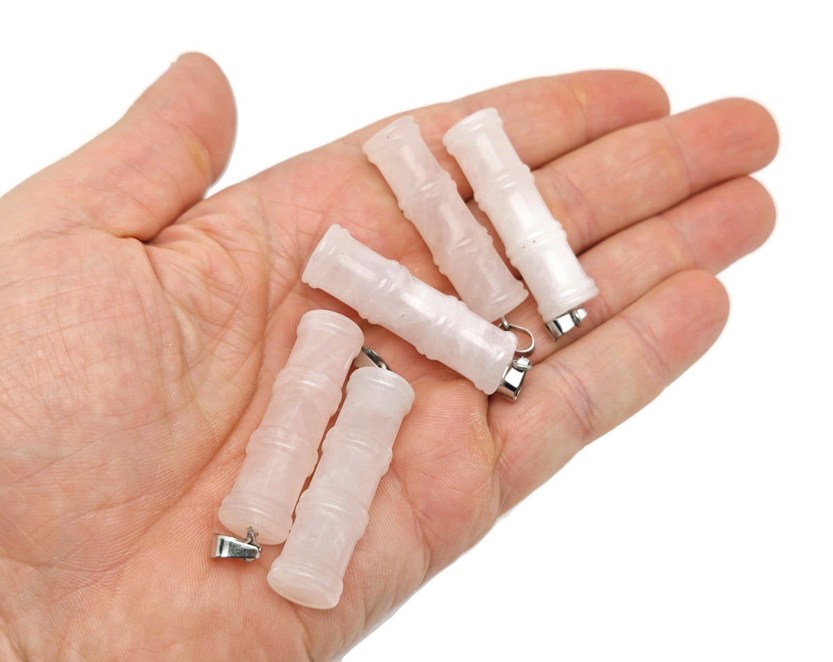 Rose quartz bamboo shape crystal pendant from GemstoneGO featuring a protective healing crystal design.