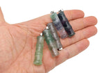 Fluorite bamboo-shaped crystal pendant from GemstoneGO featuring protective healing properties, displayed on a neutral background.