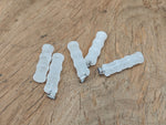 Clear quartz bamboo-shaped crystal pendant from GemstoneGO, featuring a protective NC1487 design with natural crystal clarity.