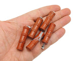 Red Jasper bamboo-shaped crystal pendant from GemstoneGO featuring a protective crystal design on a silver chain.