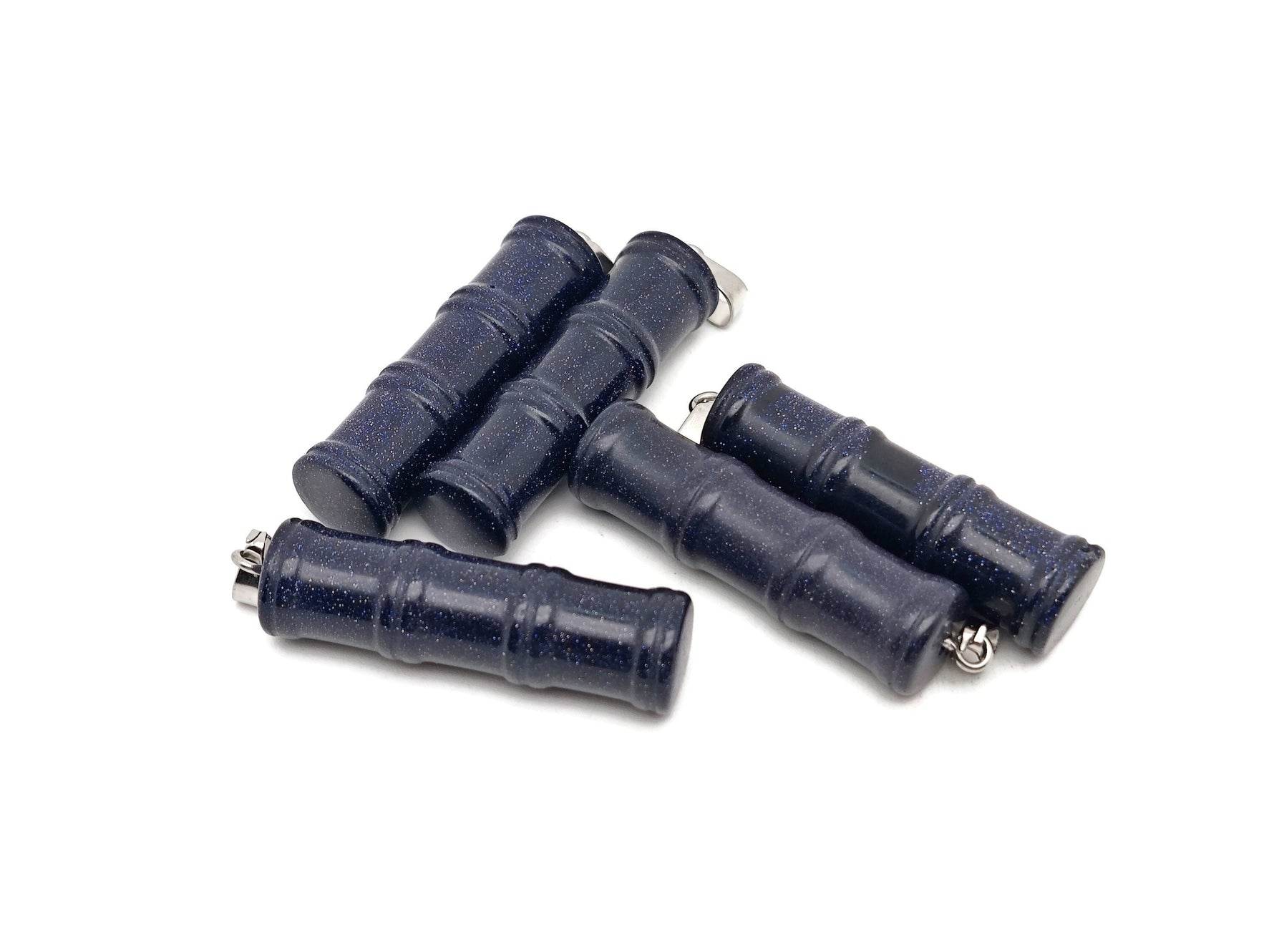 Blue Goldstone bamboo-shaped crystal pendant with protective properties from GemstoneGO, featuring a polished, vibrant blue and gold-toned design.