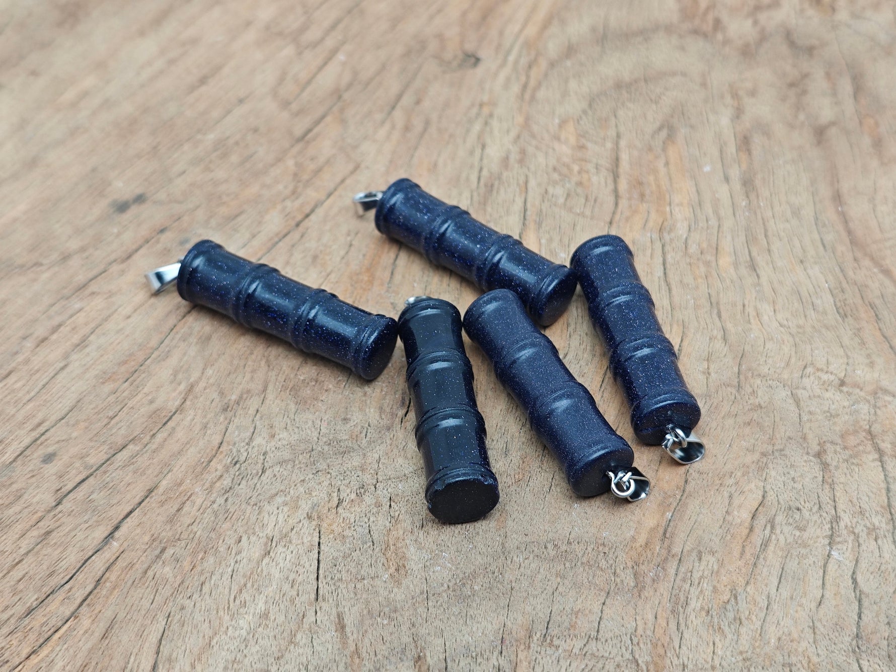 Blue Goldstone bamboo-shaped crystal pendant from GemstoneGO featuring a protective healing crystal design.