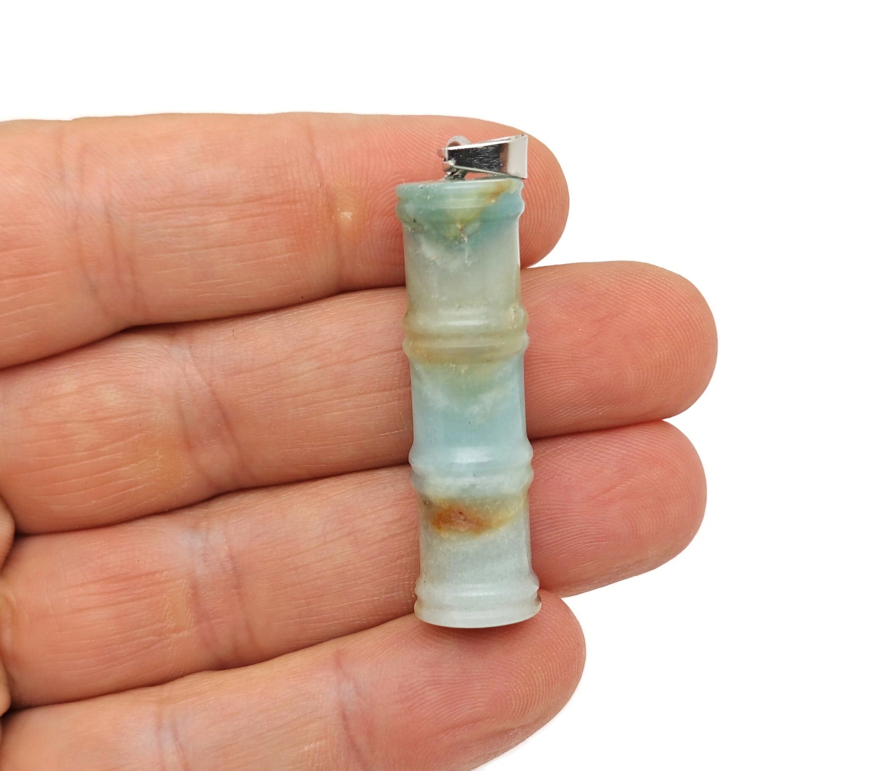 Amazonite bamboo-shaped crystal pendant by GemstoneGO featuring a protective crystal design on a silver chain.