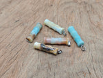 Amazonite bamboo-shaped crystal pendant from GemstoneGO featuring protective healing properties and a polished, natural gemstone appearance.