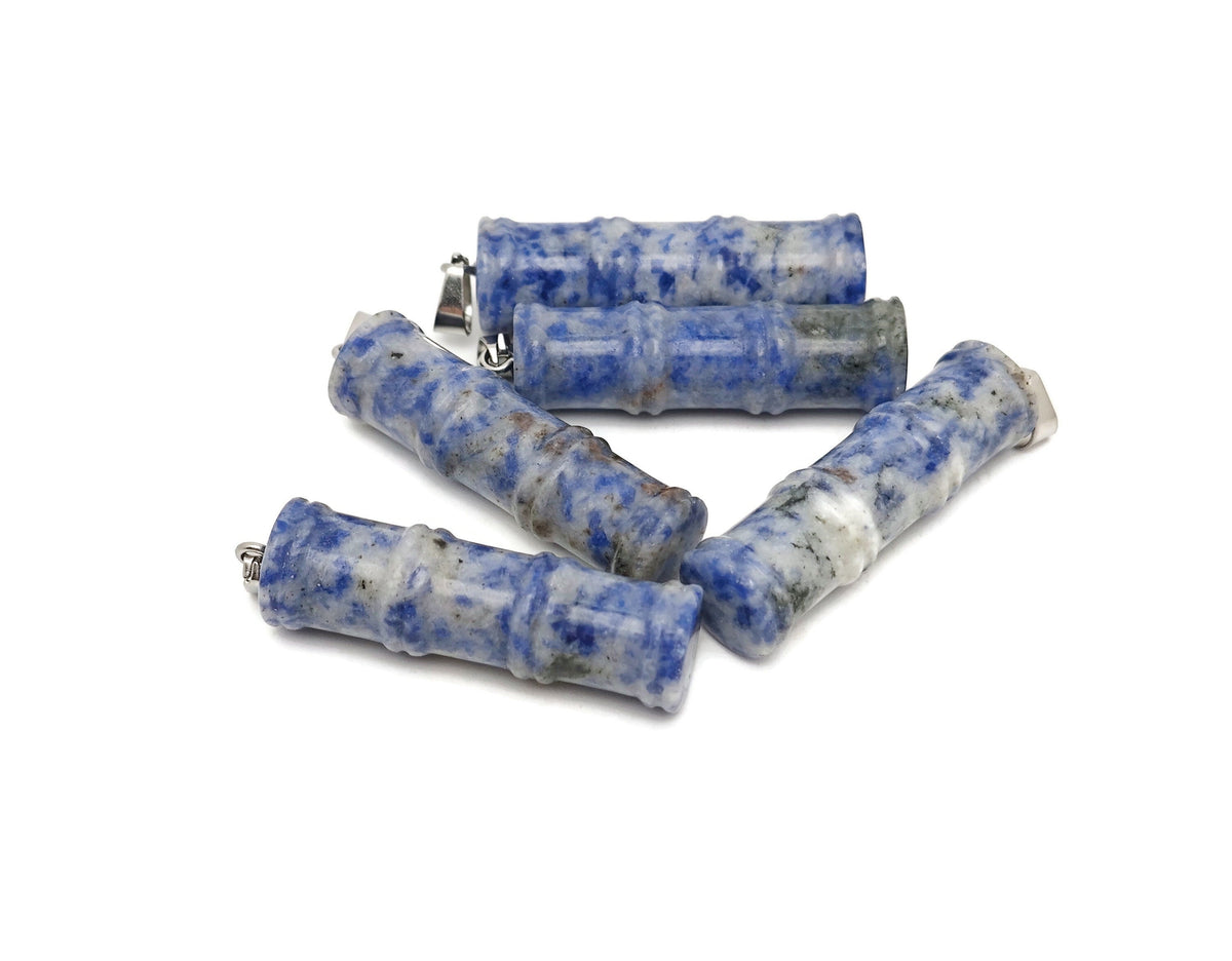 Blue Spot Jasper bamboo-shaped crystal pendant from GemstoneGO featuring a protective crystal design, showcasing intricate craftsmanship.
