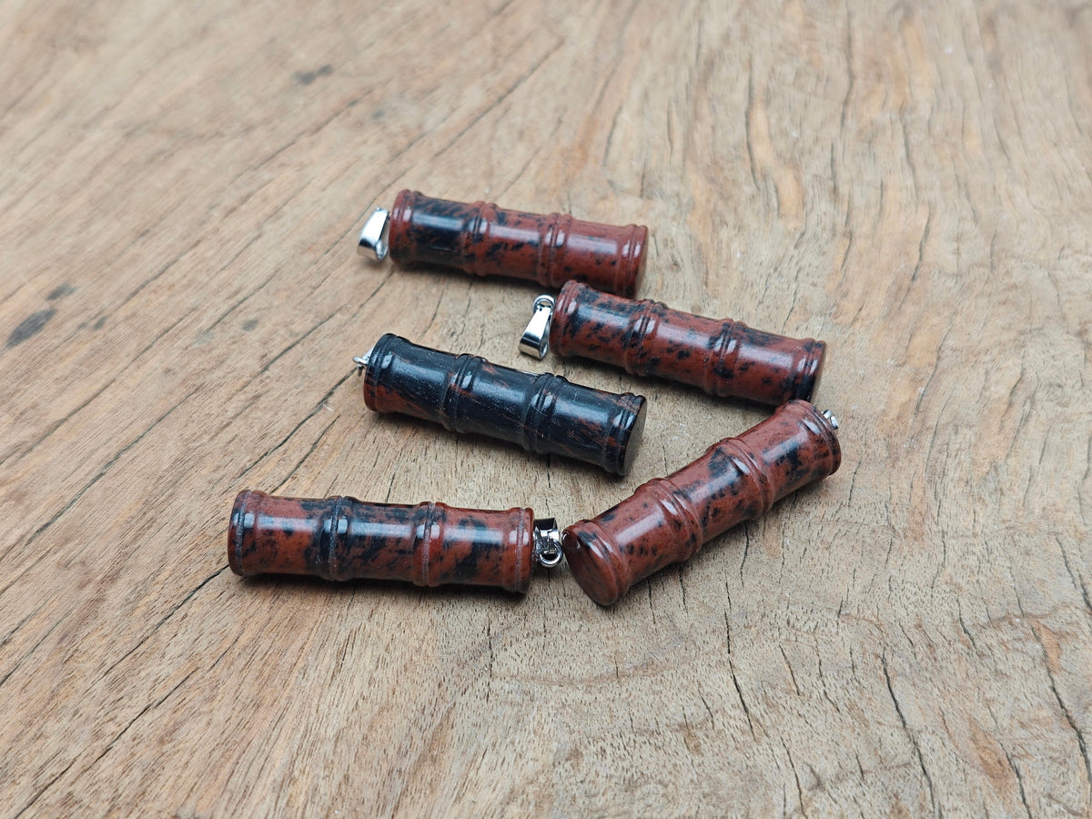 Mahogany Obsidian bamboo-shaped crystal pendant from GemstoneGO featuring protective healing stone design.