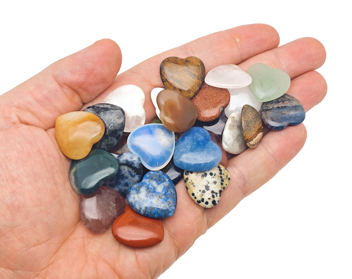 Set of 10 randomly selected gemstone crystals in a heart carving, part of the Crystal Mystery Box Gift Kit by GemstoneGO.