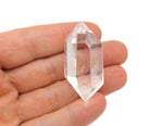 Clear quartz double obelisk tower crystal from GemstoneGO, showcasing a transparent, polished quartz crystal with a pointed top.