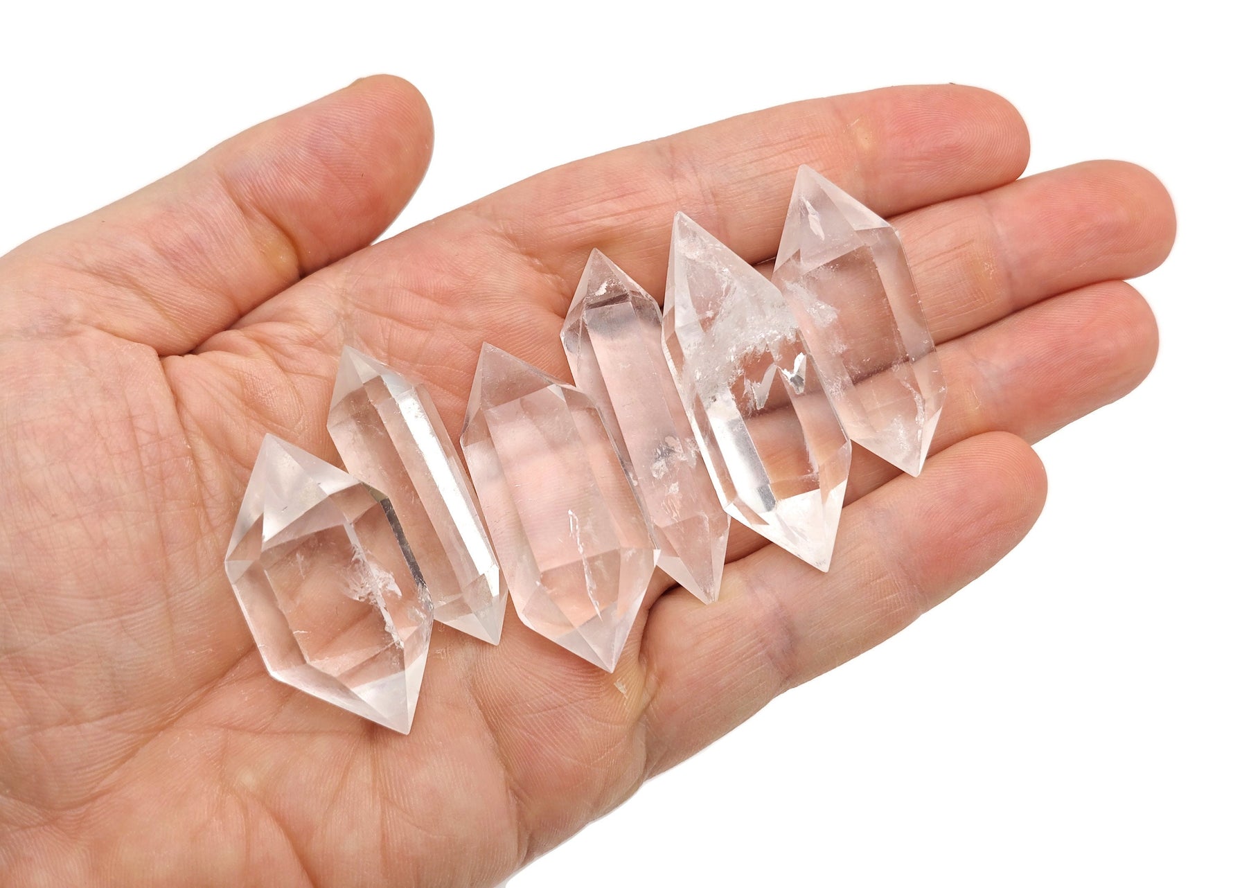 Clear Quartz double obelisk tower crystal from GemstoneGO, showing a transparent, polished gemstone with natural crystal formations.