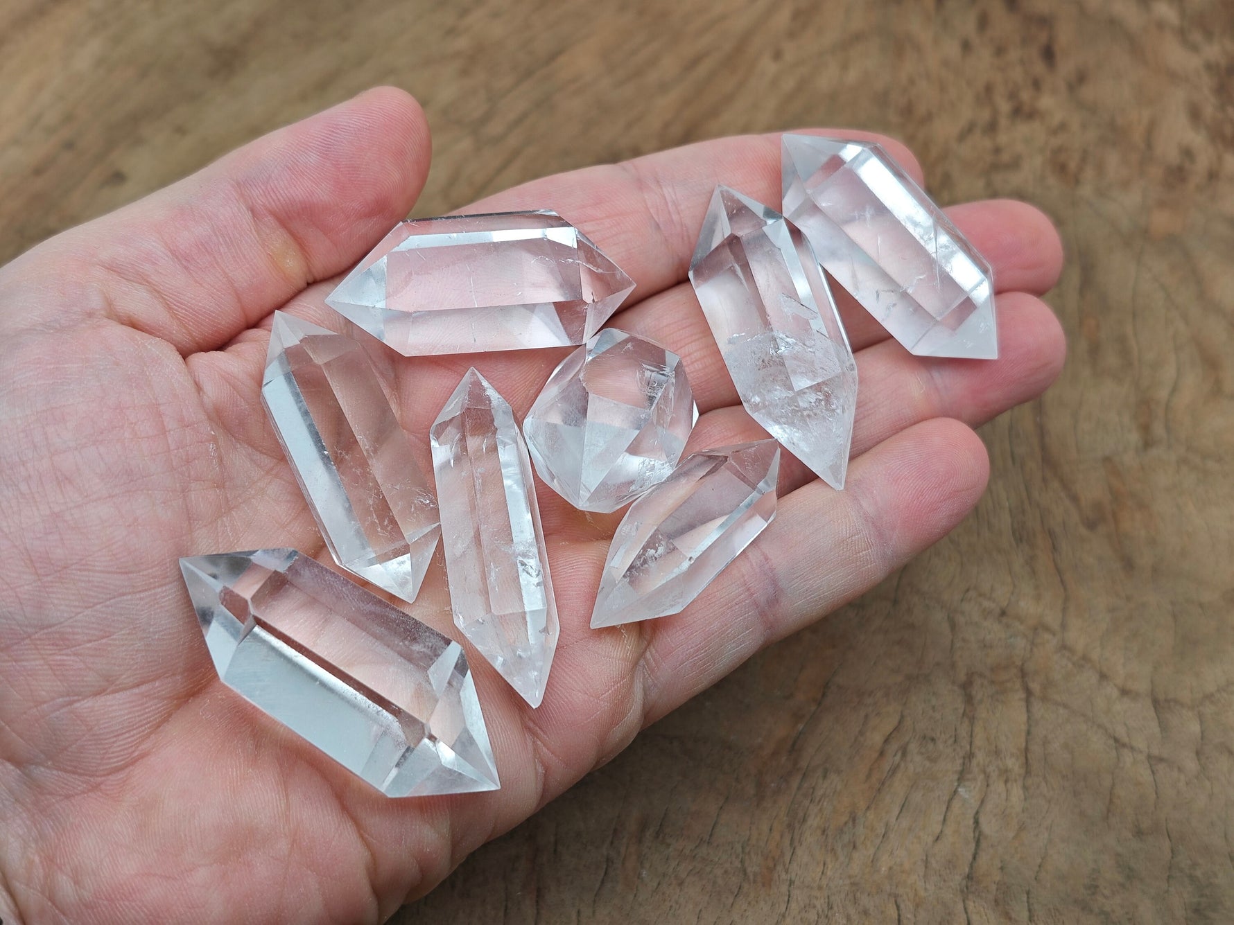 Clear Quartz double obelisk tower crystal from GemstoneGO, showcasing a tall, transparent gemstone with natural crystal formations.