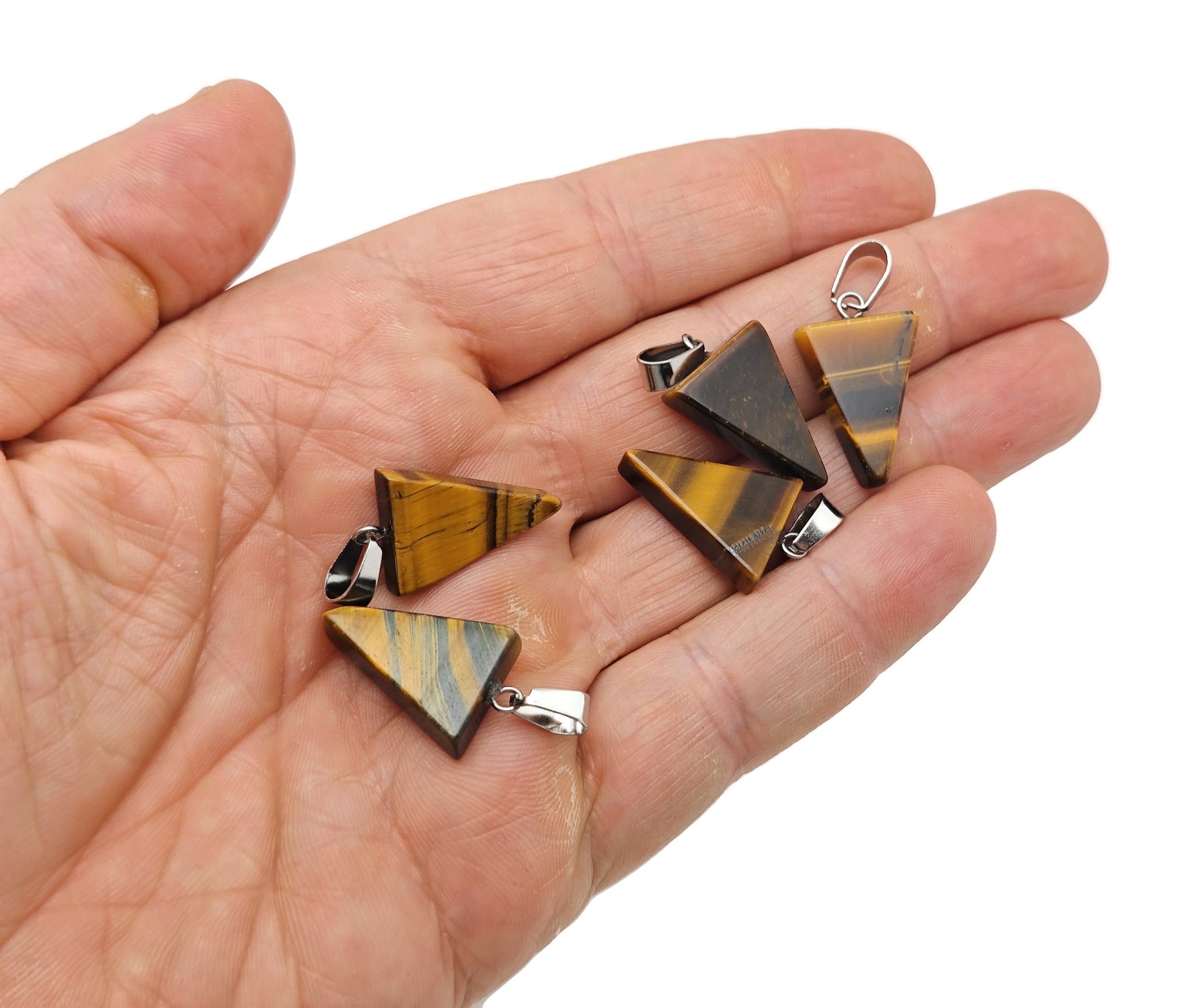 Triangle-shaped crystal pendant from GemstoneGO for jewelry making, shown in a close-up image of the faceted gemstone.