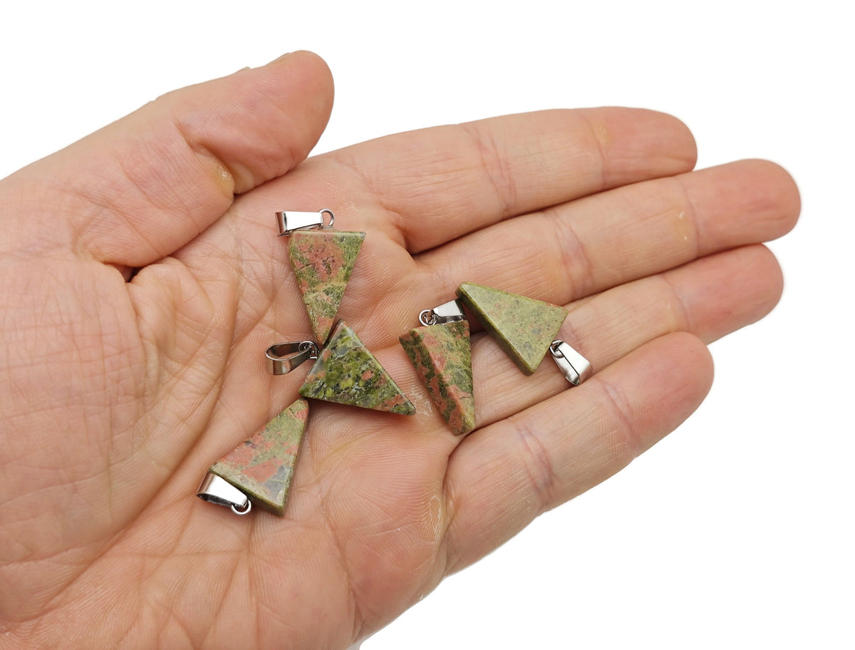 Triangle shape crystal pendant from GemstoneGO for jewelry making, shown in a close-up image with a silver bail attachment.