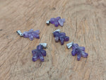 Amethyst and gingerbread-shaped crystal pendant from GemstoneGO featuring mineral specimens on a white background.