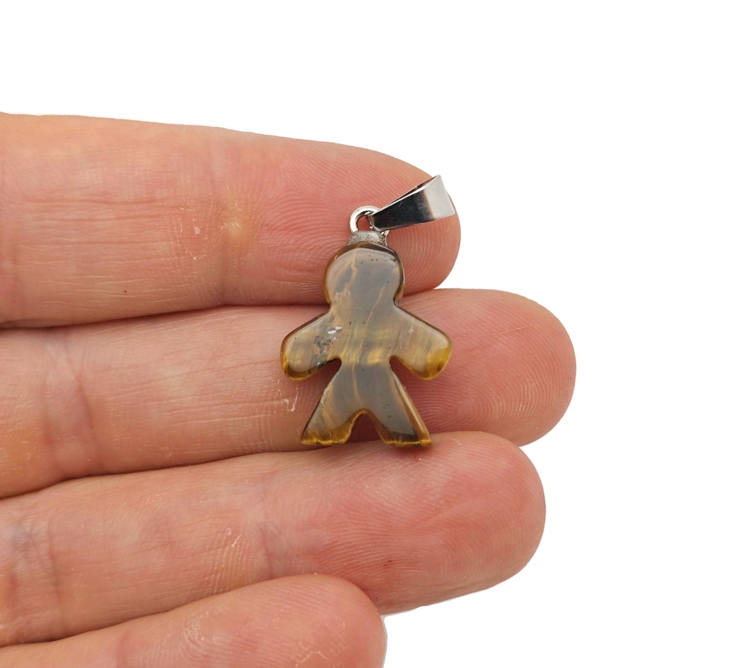 Tiger Eye gingerbread cookie-shaped crystal pendant from GemstoneGO, featuring mineral specimen details on a neutral background.